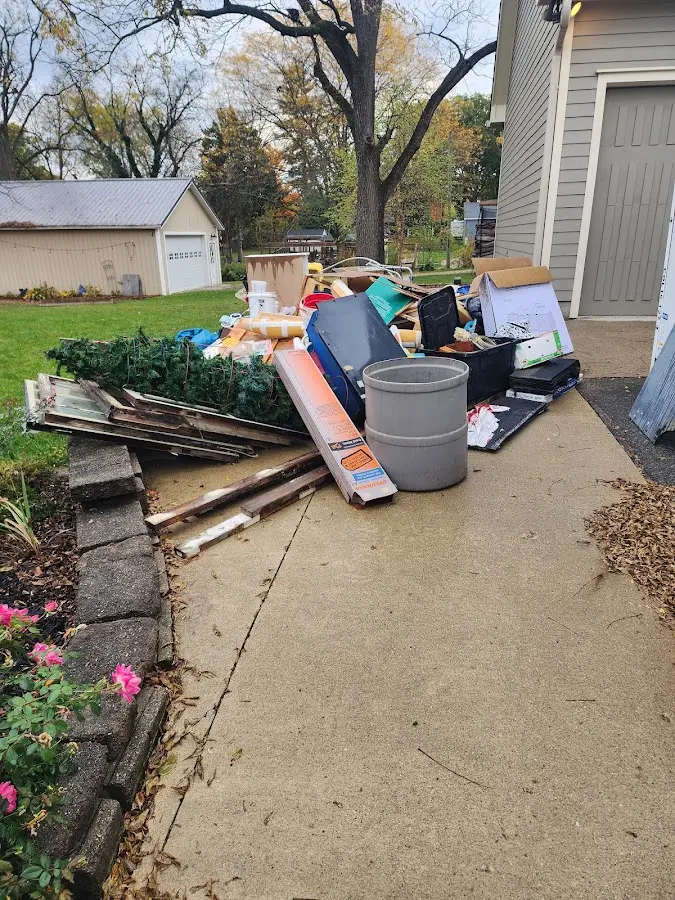 Dumpster being loaded with debris for 30 Yard Dumpster Rental in Lincoln